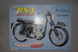 A reproduction tin sign, of BSA Gold star interest.