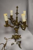 A cast metal table lamp in the form of an antique candlestick, having gilt finish.