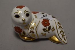 A Royal Crown Derby seal paperweight, having silver stopper.