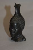 A small cast resin bronze effect traditional African bust.