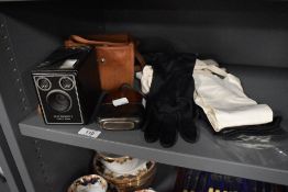 A Six-20 Brownie C camera, a Hip flask and four pairs of vintage and antique gloves, including