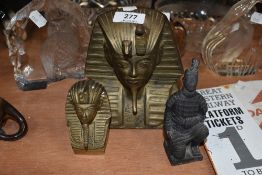 Two brass Egyptian Pharaoh heads and an oriental figure
