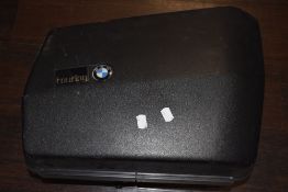 A near side BMW motorcycle pannier, with key.
