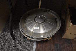 Five hub caps, thought to be Rover P6 or similar.