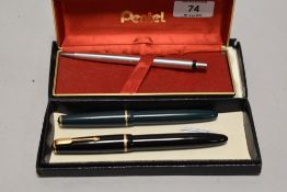 A Parker Victory in green, a Parker Duofold in black and a Pentel propelling pencil.