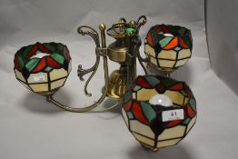 A Tiffany style ceiling centre light, having three shades.