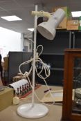 A vintage mid century style adjustable lamp.