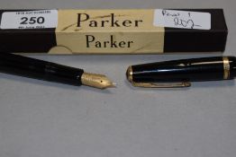 A boxed Parker Duofold in black having a Parker 50 nib. In good condition, engraved