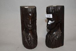 A pair of mid century carved wood African heads.