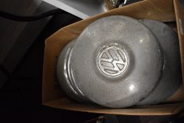 A collection of various Volkswagen hub caps.
