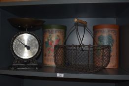 A set of traditionally styled Salter scales, an egg basket and two cylindrical cardboard