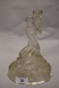 An Art Deco moulded glass lamp base in the style of Lalique, depicting nude maiden on rocks