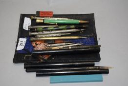 A selection of eleven various propelling pencils and leads.