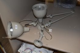 A pair of new desk top mounted engineers or craft workers adjustable lamps.