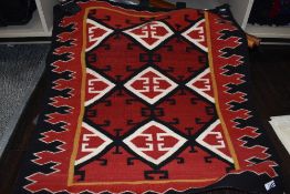 Two vintage North Navaho American Native style wall hangings with a geometric design. 79cm x 80cm