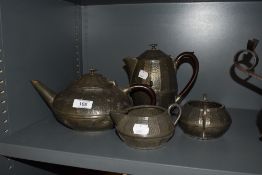 An early 20th century pewter teapot, coffeepot, sugar and creamer.
