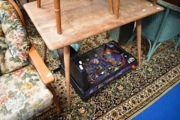 A vintage Ercol table with spindle undertier