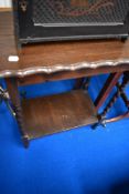 An early 20th Century oak occasional table having twist frame