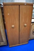 A vintage teak wardrobe , labelled EON