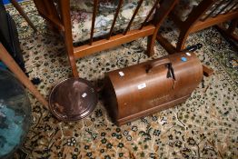 A vintage Singer sewing machine in case and a copper bed warming pan