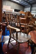A traditional stained frame kitchen armchair