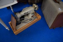 A vintage Oresta electric sewing machine