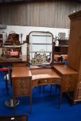 A 19th Century mahogany dressing table having large brass handles and inlaid decoration, width