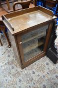 A 19th Century oak side cabinet having glazed door, possibly shop fitting
