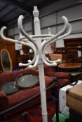 A traditional painted bentwood hat stand