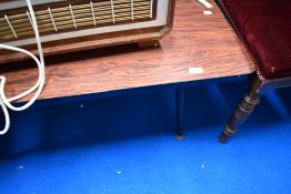 A vintage melamine topped coffee table on dansette legs