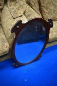 An early 20th Century oak oval wall mirror