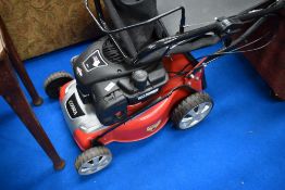 A Cobra petrol lawnmower having Briggs and Stratton engine