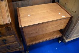 A vintage teak tea trolley