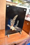 A vintage firescreen with painted floral applique decoration