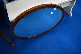 An early 20th Century mahogany oval wall mirror