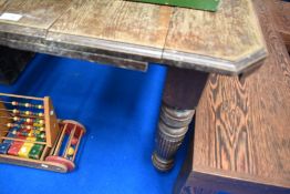 A Victorian oak wind out dining table, top rough with no additional leaves