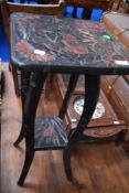 A 19th Century occasional table or plant stand having decorative and stylised frame
