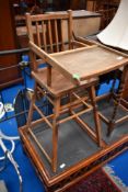 A vintage stained frame high chair