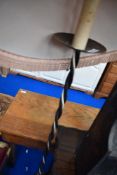A wrought iron standard lamp