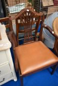A reproduction mahogany carver chair with mismatched drop in seat