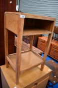 A mid 20th Century golden oak bedside table