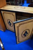 A metal and stained frame side cabinet having painted faux inlay decoration