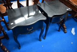 A pair of Continental style bedside drawers with shaped granite tops