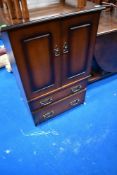 A reproduction side/TV cabinet with faux drawer and real drawer to base