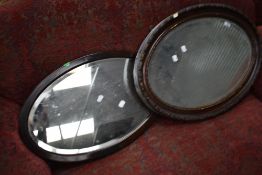 Two oval wall mirrors