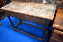 A Victorian oak side table having drawer to end