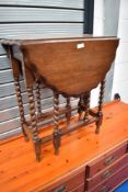 An early 20th Century oak twist gateleg occasional table