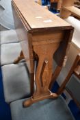 An Arts and Crafts style golden oak occasional gateleg table, width approx. 61cm