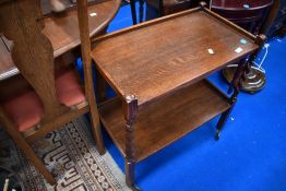 An early 20th Century tea trolley having twist frame