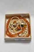 A small collection of miscellaneous jewellery, to include a string of pearls with 9K gold stamped